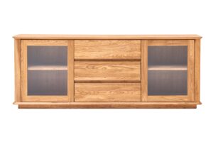Skříňka pod TV Celin z masivního dubového dřeva kombinuje nadčasový design s praktickým úložným prostorem. Prosklené skříňky s nastavitelnými policemi a zásuvky se soft close dělají z tohoto kusu ideální centrum vašeho obývacího pokoje.